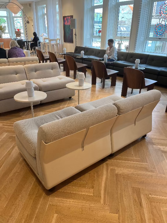Hay Amanta Sofa by mario bellini launch 3dd 2025. Modern living room with beige sofas, wooden coffee tables, and large windows.