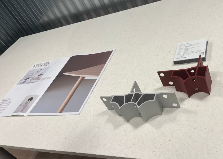 Hay Annex table Metal brackets and a leaflet on a table with a gray background