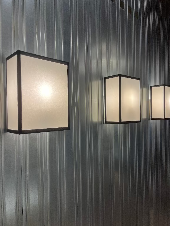 Three square Hay Ava wall lights on a metallic wall by Ana Kras at 3 days of design 2025 copenhagen