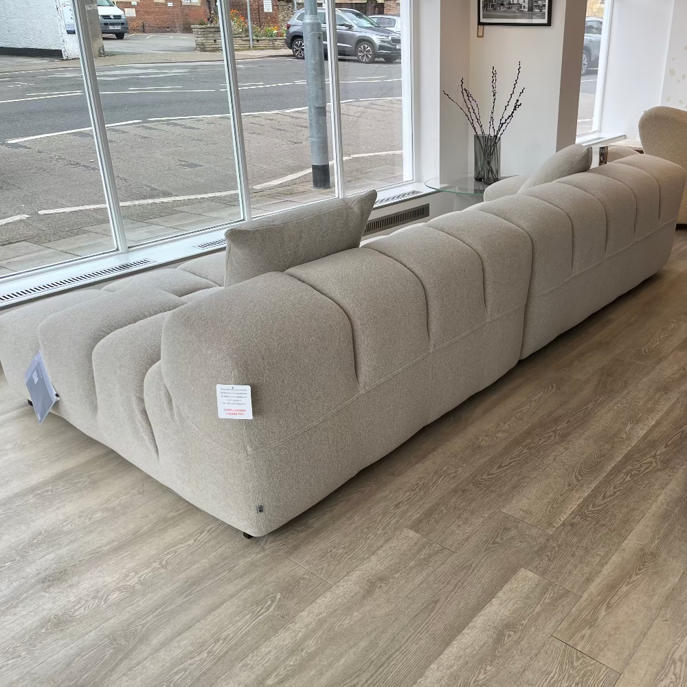 rear of B&B Italia Tufty-Time 20 modular sofa in light greige fabric in showroom Innes