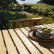 Skagerak Cadence Outdoor Dining Table and Dining Chair in Untreated Teak — lifestyle, detail