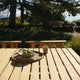 Skagerak Cadence Outdoor Dining Table and Dining Chair in Untreated Teak — lifestyle, detail