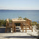 Skagerak Cadence Outdoor Dining Chair and Dining Table in Untreated Teak — lifestyle