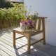 Skagerak Cadence Outdoor Dining Chair in Untreated Teak — lifestyle