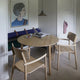  Skagerak Hven Round Oak Dining Table and Hven Oak Dining Armchair — lifestyle