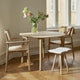 Skagerak Georg Low Stool in Untreated Oak with Linen Cushion — lifestyle, with Hven Armchair and Hven Dining Table