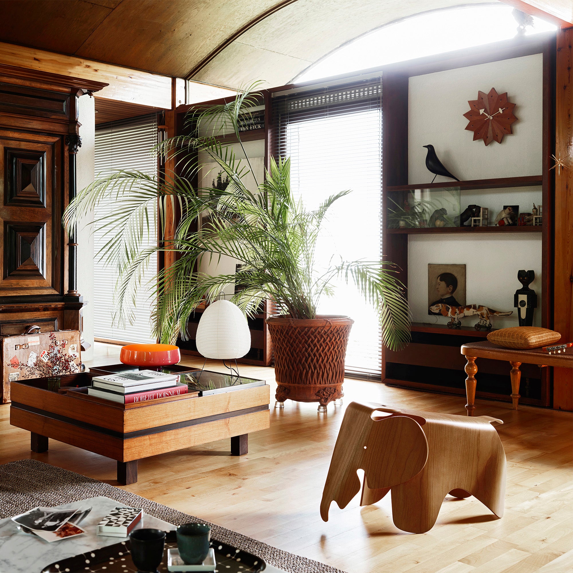 Vitra Fan Wall Clock — lifestyle, with Eames Elephant, Eames House Bird, and Akari Light