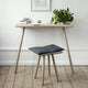 Skagerak Georg Low Stool in Untreated Oak with Dark Grey Cushion — lifestyle, with Georg Console