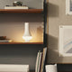 Louis Poulsen Tomoshi Portable Lamp in White — lifestyle, bookcase