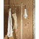 Louis Poulsen Tomoshi Portable Lamp in White — lifestyle, clothes rack, lamp off