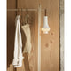 Louis Poulsen Tomoshi Portable Lamp in White — lifestyle, clothes rack, lamp on