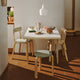 Artek Aalto DL81C Foldable Dining Table in White HPL — lifestyle, with Artek Chair 69, Artek 60 Low Stool and Artek A440 Pendant Light