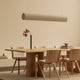 Audo Hashira Linear Pendant Light — lifestyle, with Audo Androgyne Dining Table, Audo Ready Dining Chair, and Audo Stance Vase