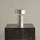 Audo Column Portable Table Lamp in Brushed Aluminium — studio, with Plinth Tall