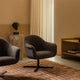 Audo Harbour Lounge Chair Swivel — lifestyle, with Plinth Tall, Crescent Shelving and Tile Rug