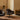 Audo Harbour Lounge Chair Swivel — lifestyle, with Plinth Tall, Crescent Shelving and Tile Rug