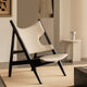 Audo Knitting Lounge Chair in Black Oak — lifestyle, with Androgyne Side Table, Column Table Lamp and Plinth Low