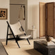 Audo Knitting Lounge Chair in Black Oak — lifestyle, with Androgyne Side Table, Column Table Lamp and Plinth Low