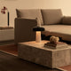 Audo Offset 2 Seater Sofa Bed — lifestyle, with Audo Duomo Rug, Audo Plinth Low Table, and Audo Reverse Table Lamp