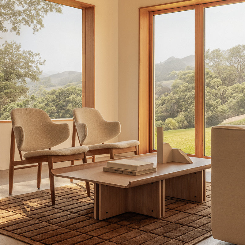 udo The Penguin Wooden Lounge Chair Upholstered in Logan Fossil — studio, with Conrad Lounge Table, Tile Rug and Eave Seamline Lounge Chair