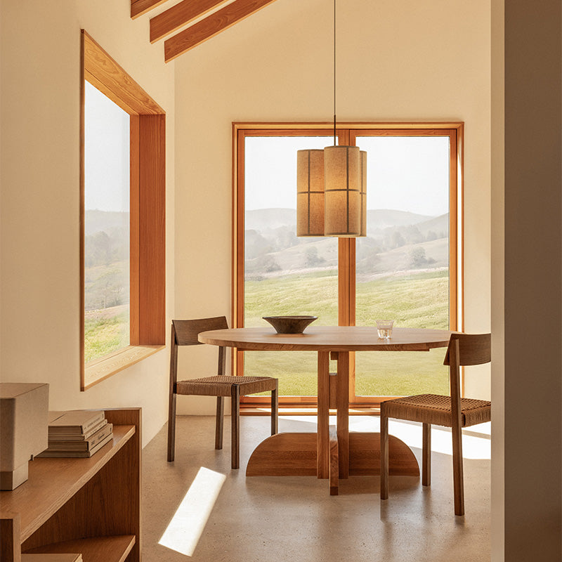 Audo Puffin Dining Table Round — lifestyle, with Mauro Dining Chair, Crescent Shelving, Nonna Table Lamp and Hashira Cluster Pendant