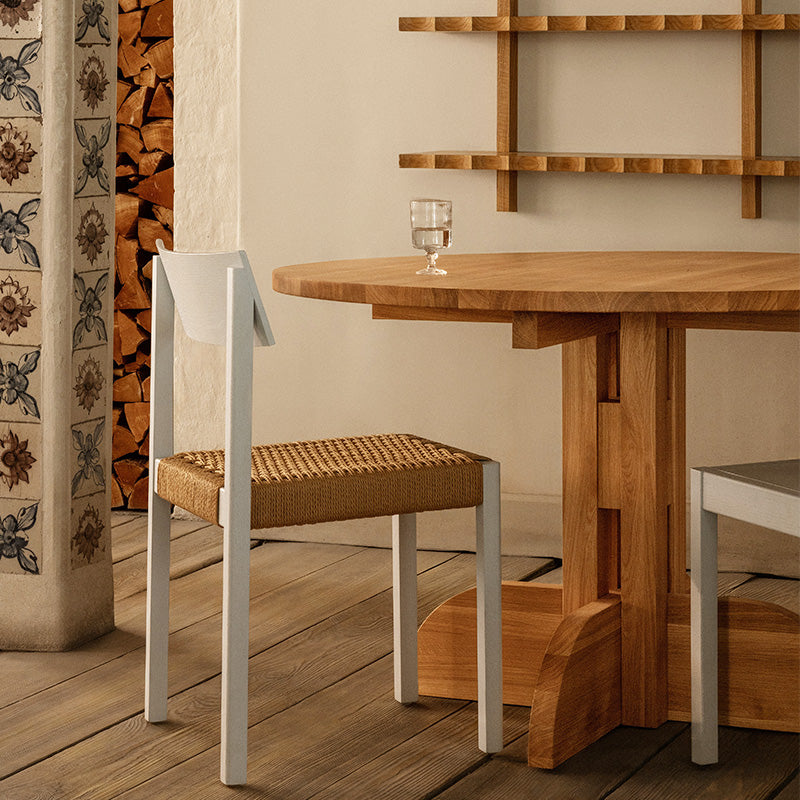 Audo Puffin Dining Table Round — lifestyle, with Mauro Dining Chair Paper Cord