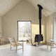 Carl Hansen CH44 Lounge Chair in Oak Soap — lifestyle, with CH004 nesting tables and CH53 stool