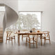 Carl Hansen CH24 Wishbone Chair — lifestyle, with CH22, CH008 and CH327 in Teak Oak Oil