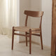 Carl Hansen CH23 Dining Chair in Walnut Oil, natural paper cord — lifestyle