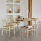 Carl Hansen CH24 Wishbone Chair in Beech Hollyhock, Natural Cord — lifestyle, with CH53 in Oak Soap and CH337 in Oak Soap