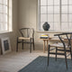 Carl Hansen CH24 Wishbone Chair in Beech Slate, Natural Cord — lifestyle, with CH011 in Oak Soap