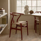 Carl Hansen CH24 Wishbone Chair in Beech Terracotta, Natural Cord — lifestyle, with CH337 in Oak Soap