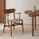 Carl Hansen CH26 Dining Chair in Walnut Oil, natural paper cord — lifestyle with CH337