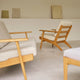 Carl Hansen CH290 Lounge Chair in Oak Oil, Bute Storr 1501 Eggshell — lifestyle, with CH293 and CH290F Footstool