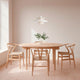 Carl Hansen CH24 Wishbone Chair in Oak White Oil — lifestyle, with CH337 Dining Table