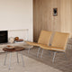 Carl Hansen CH415 Coffee Table in Walnut Oil — lifestyle, with CH401 lounge chair