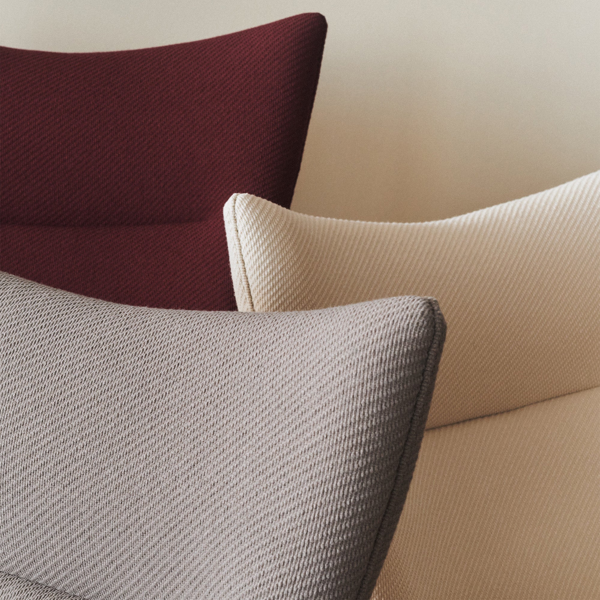 Carl Hansen CH445 Wing Chair Special Edition in Deep Burgundy, Pebble Brown and Clay White — studio, upholstery detail