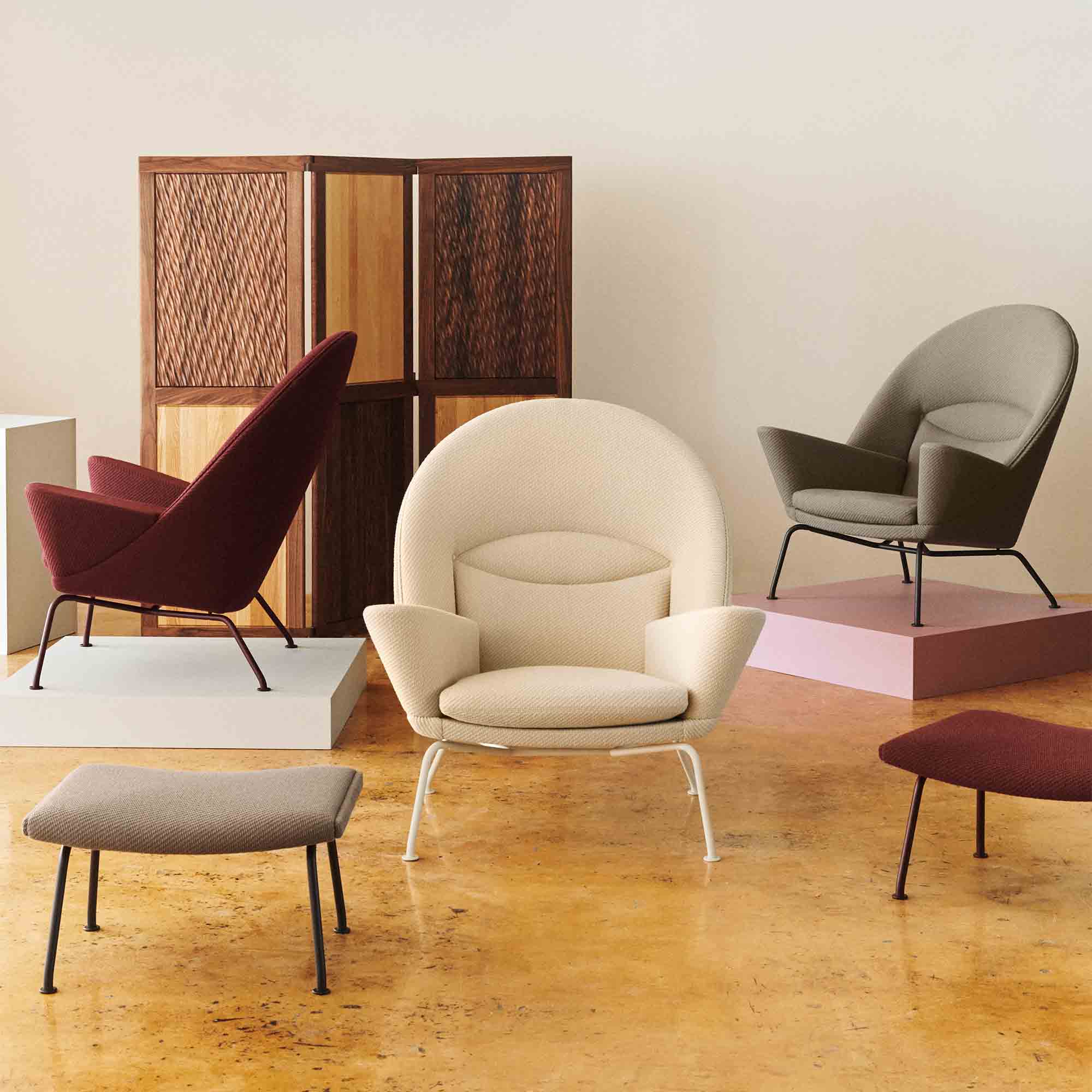 Carl Hansen CH468 Oculus Chair Special Edition in Clay White, Deep Burgundy and Pebble Brown — studio, with CH446 Footrests