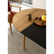 Hansen BM0121 Extendable Round Dining Table styled with Black MDF BM0121I 120x60cm Extension Leaf and Carl Hansen BM1106 Huntsman Chair — lifestyle shot 1