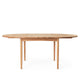 Carl Hansen BM0121 Extendable Round Dining Table in Oak Oil with oak oil extension leaf