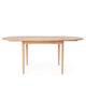 Carl Hansen BM0121 Extendable Round Dining Table in Oak Soap with oak soap extension leaf