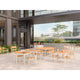 Skagerak Pelagus Outdoor Dining Armchair and Dining Chair with Dining Table in Light Ivory — lifestyle, hospitality setting