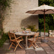 Skagerak Drachmann Outdoor Dining Chair and Round Dining Table — lifestyle