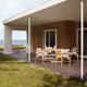 Carl Hansen E022 Embrace Outdoor Dining Table in Teak — lifestyle, with E008 Outdoor Dining Chair