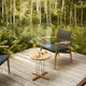 Carl Hansen E023 Embrace Outdoor Lounge Table in Teak — lifestyle, with E018 Outdoor Lounge Chair