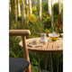 Carl Hansen E018 Embrace Outdoor Lounge Chair in Untreated Teak with Panama Hollin 1779 Cushion — lifestyle