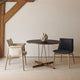 Carl Hansen E020 Embrace Dining Table — lifestyle, with E004 Embrace Dining Chair and E005 Embrace Dining Armchair