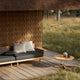 Carl Hansen Embrace Outdoor Sofa Modules in Teak — lifestyle, with E500, E510 and E023 Lounge Table
