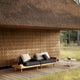 Carl Hansen Embrace Outdoor Sofa Modules in Teak — lifestyle, with E520, E510 and E023 Lounge Table
