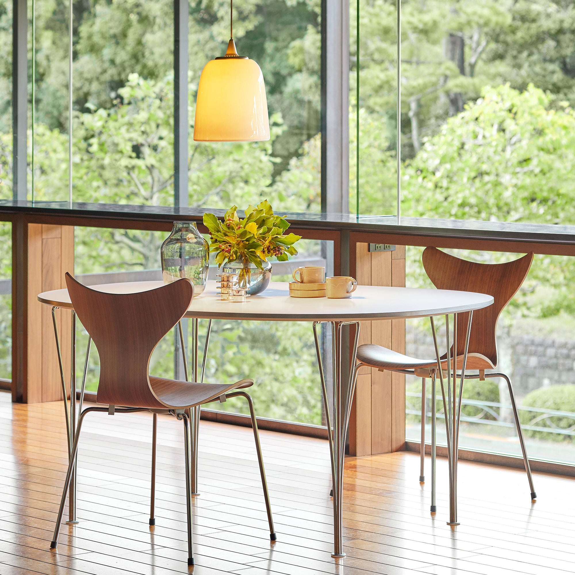 Fritz Hansen 3108 Lily Dining Chair in Walnut with Chrome Base — lifestyle